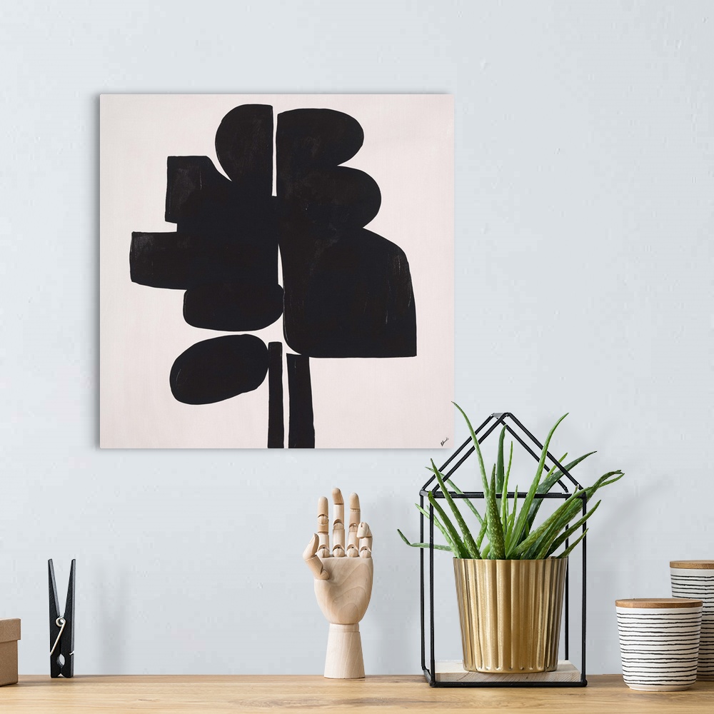 A bohemian room featuring Abstract painting using heavy black paint to make shapes, almost appearing as something in silhou...