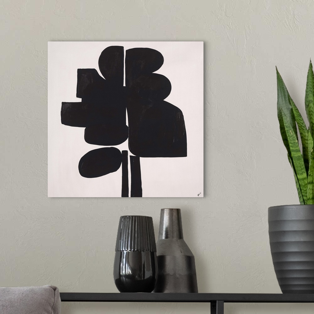 A modern room featuring Abstract painting using heavy black paint to make shapes, almost appearing as something in silhou...