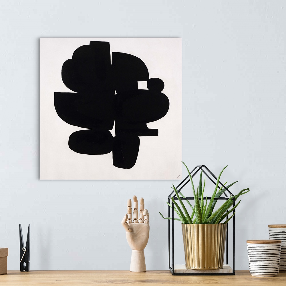 A bohemian room featuring Contemporary abstract painting of dense black organic shapes huddled together.