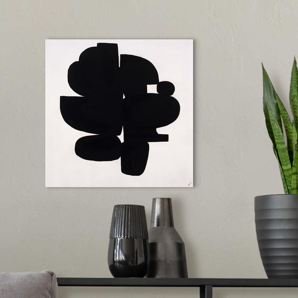 A modern room featuring Contemporary abstract painting of dense black organic shapes huddled together.