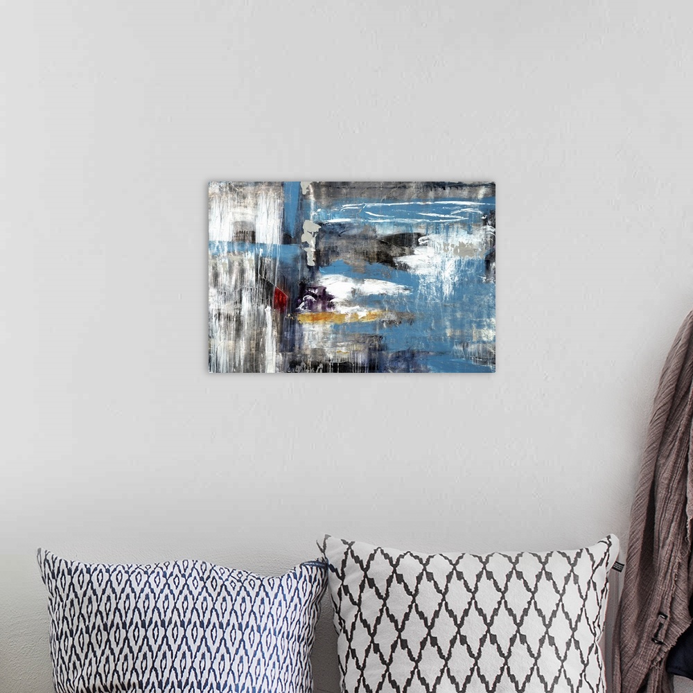A bohemian room featuring Contemporary abstract painting using blue and gray tones smeared together and washed looking.