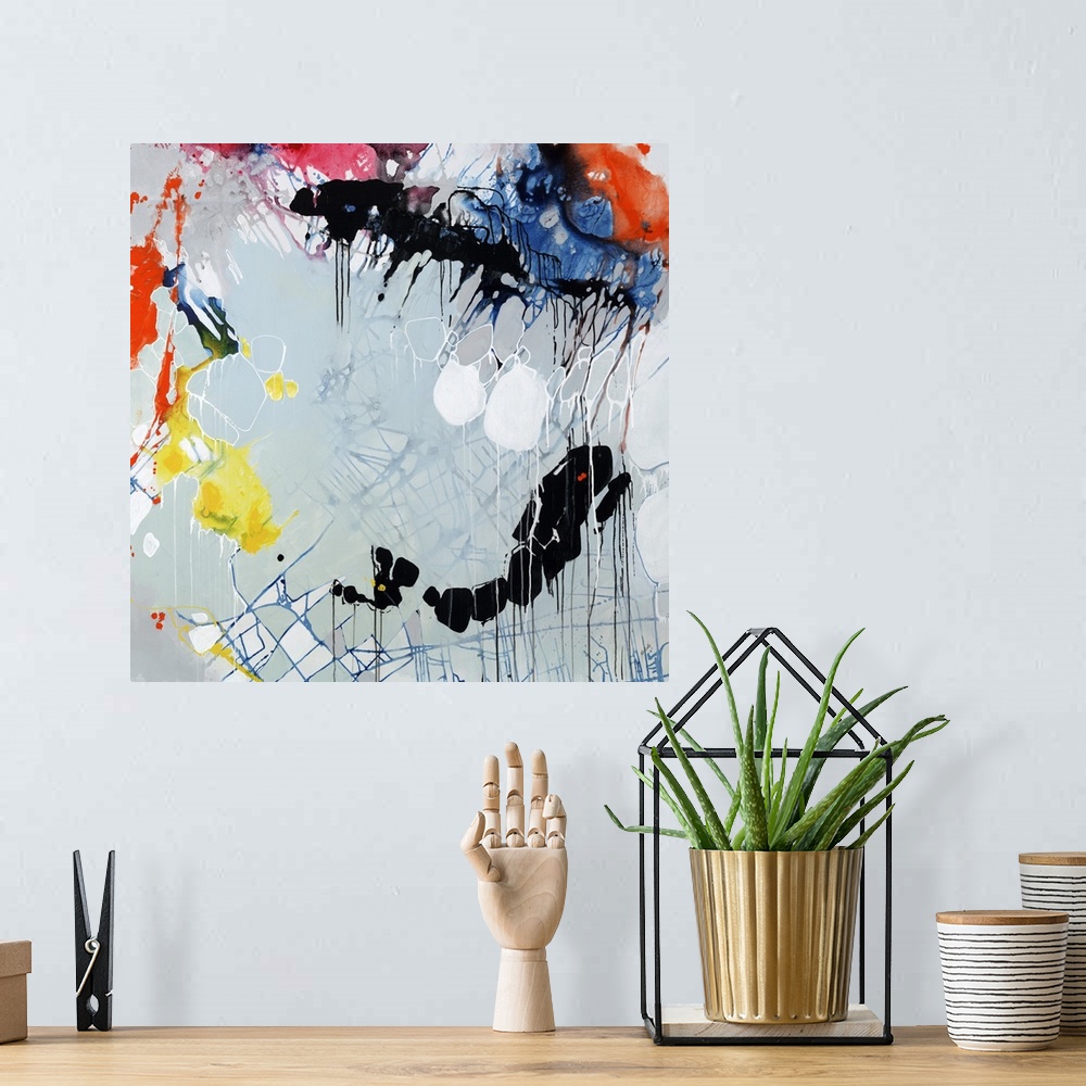 A bohemian room featuring Colorful splatter abstract painting  with circular shapes, blue grid lines, and paint dripping th...