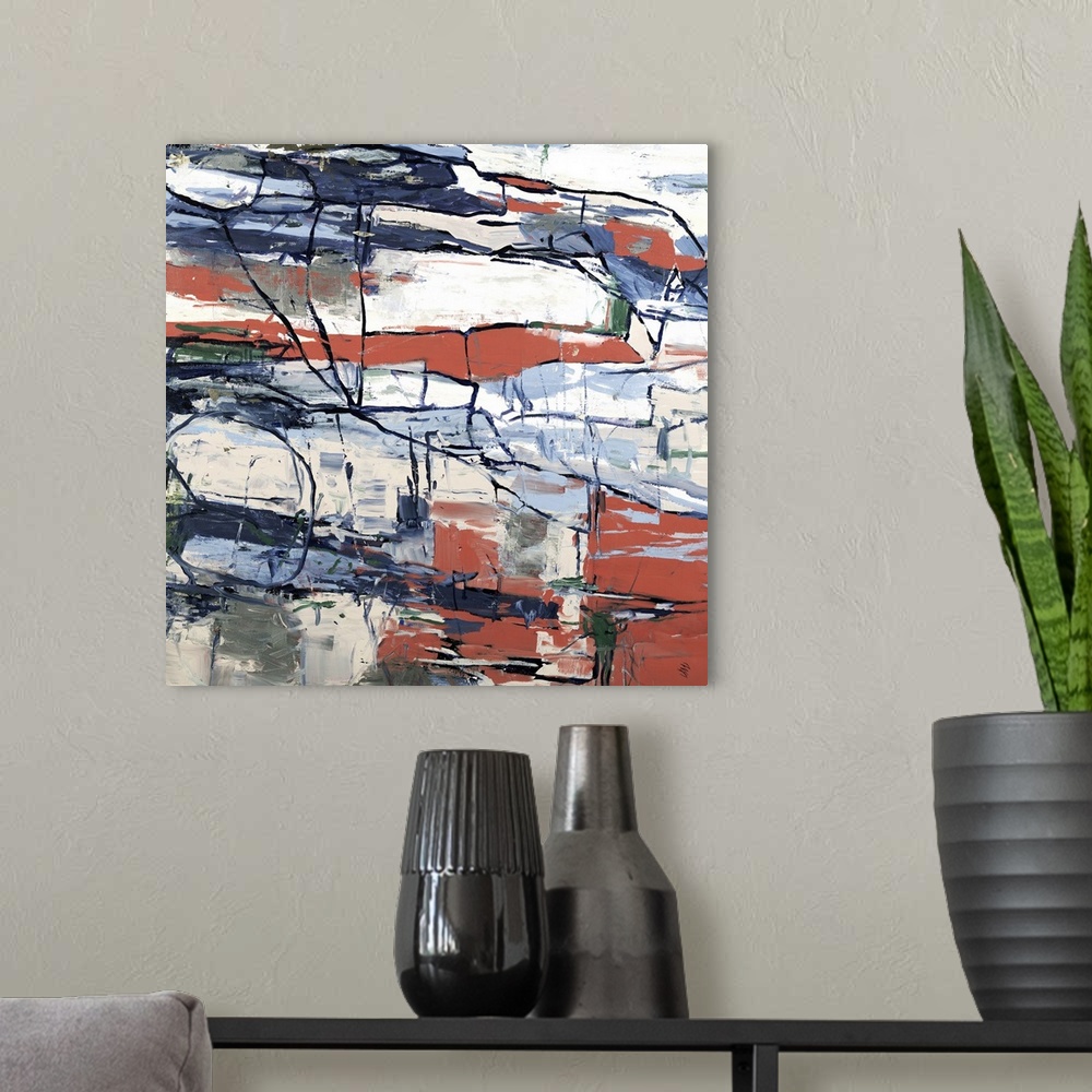 A modern room featuring Square abstract art with deep coral, emerald green, cream, gray, and shades of blue sectioned out...