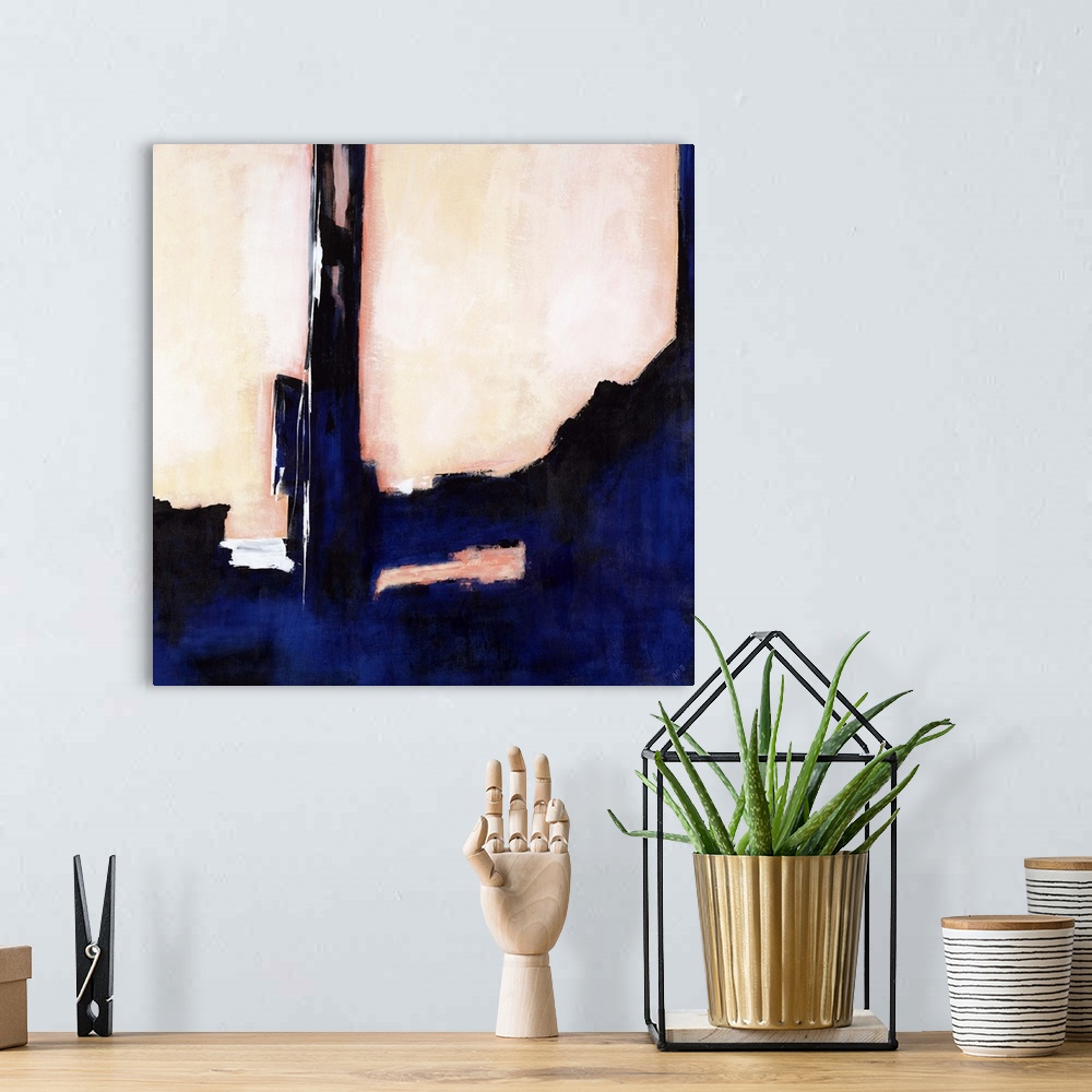 A bohemian room featuring Abstract painting with a deep, thick blue and black design taking up most of the canvas on a subt...