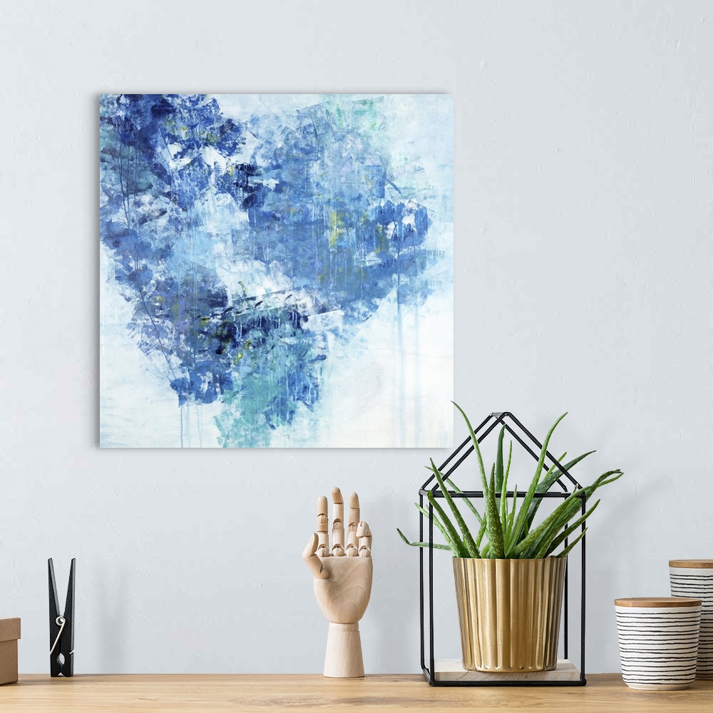 A bohemian room featuring Abstract painting of textured brush strokes in shades of blue in the shape of a heart.
