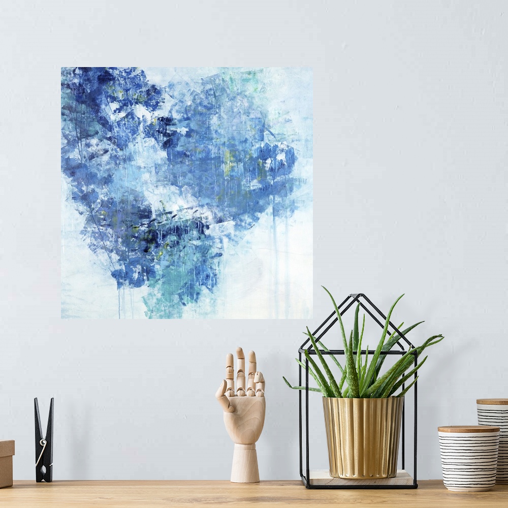 A bohemian room featuring Abstract painting of textured brush strokes in shades of blue in the shape of a heart.