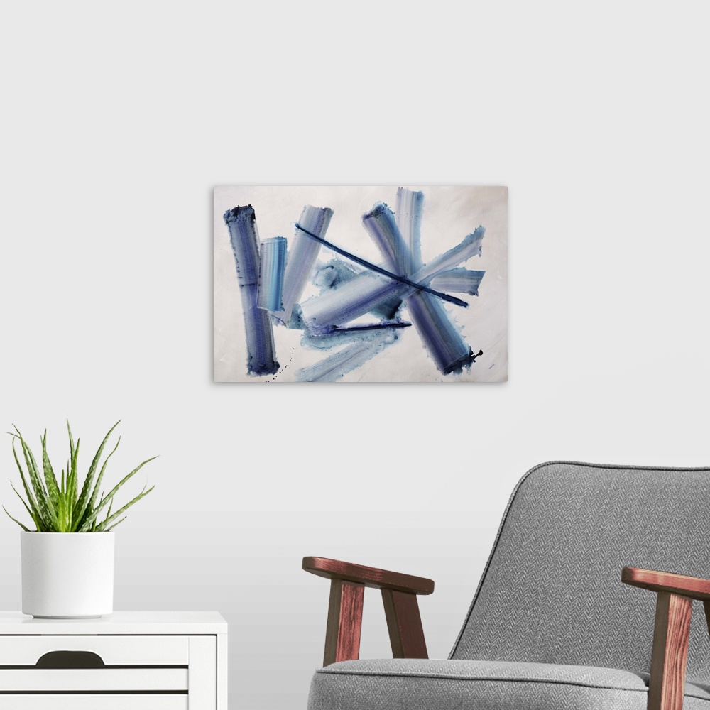 A modern room featuring An energetic blend of crossing strokes of blue and gray colors in the center of the artwork.