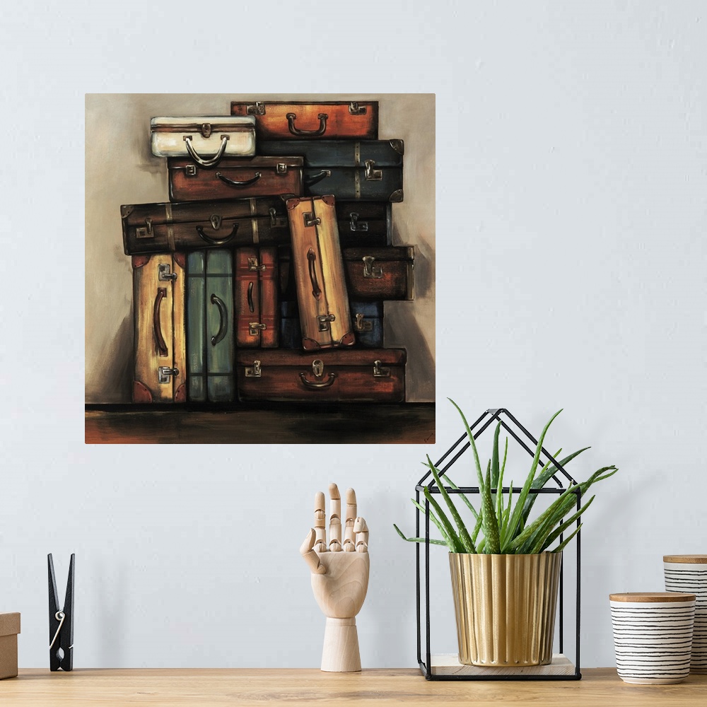 A bohemian room featuring Painting of a an assortment of multicolored vintage suitcases stacked together in front of a neut...