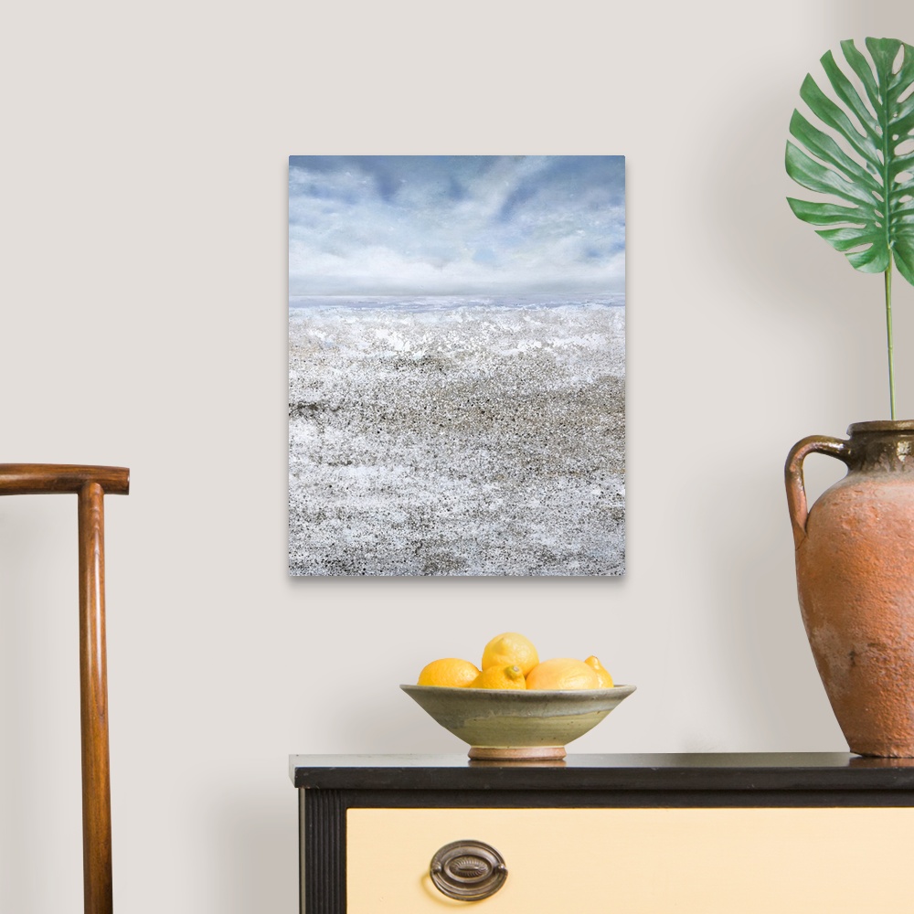 A traditional room featuring Contemporary seascape painting of a sandy beach and the ocean.