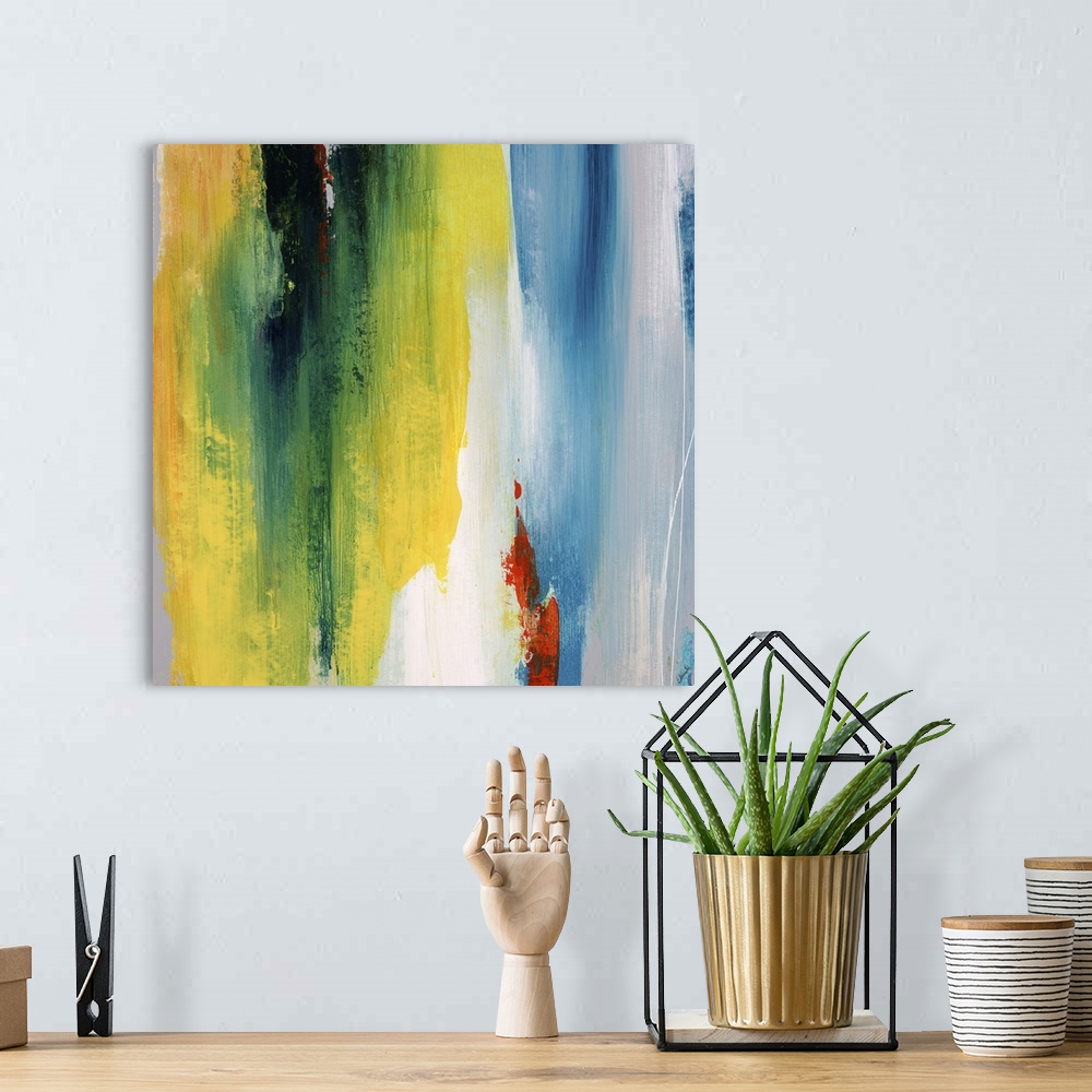 A bohemian room featuring Abstract painting using a spectrum of bright colors looking like cascading water.