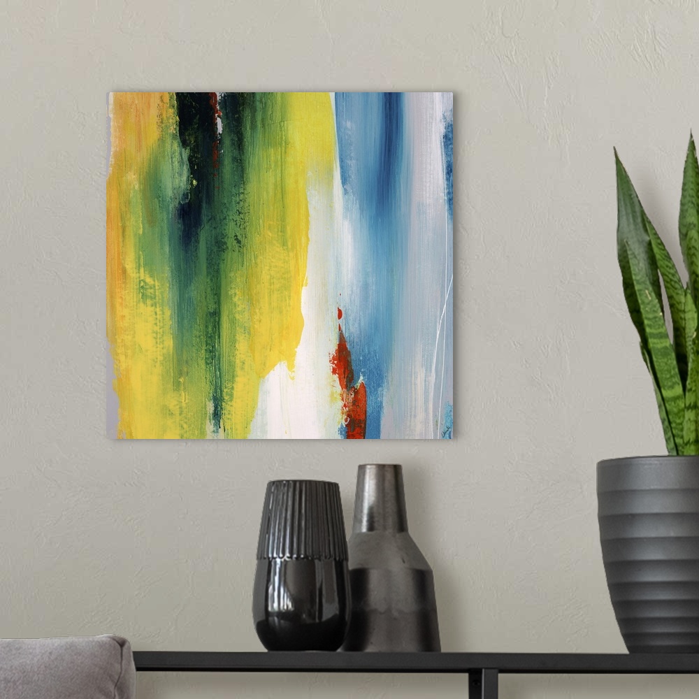 A modern room featuring Abstract painting using a spectrum of bright colors looking like cascading water.