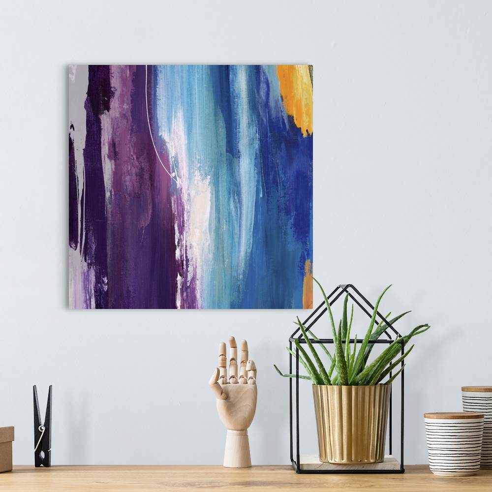 A bohemian room featuring Abstract painting using a spectrum of bright colors looking like cascading water.