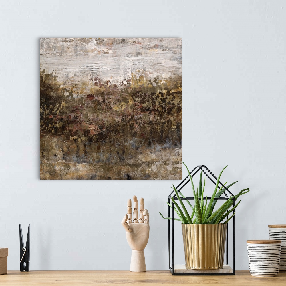 A bohemian room featuring Abstract painting of a grassy field in golden earth tones, beneath a bright cloudy sky.