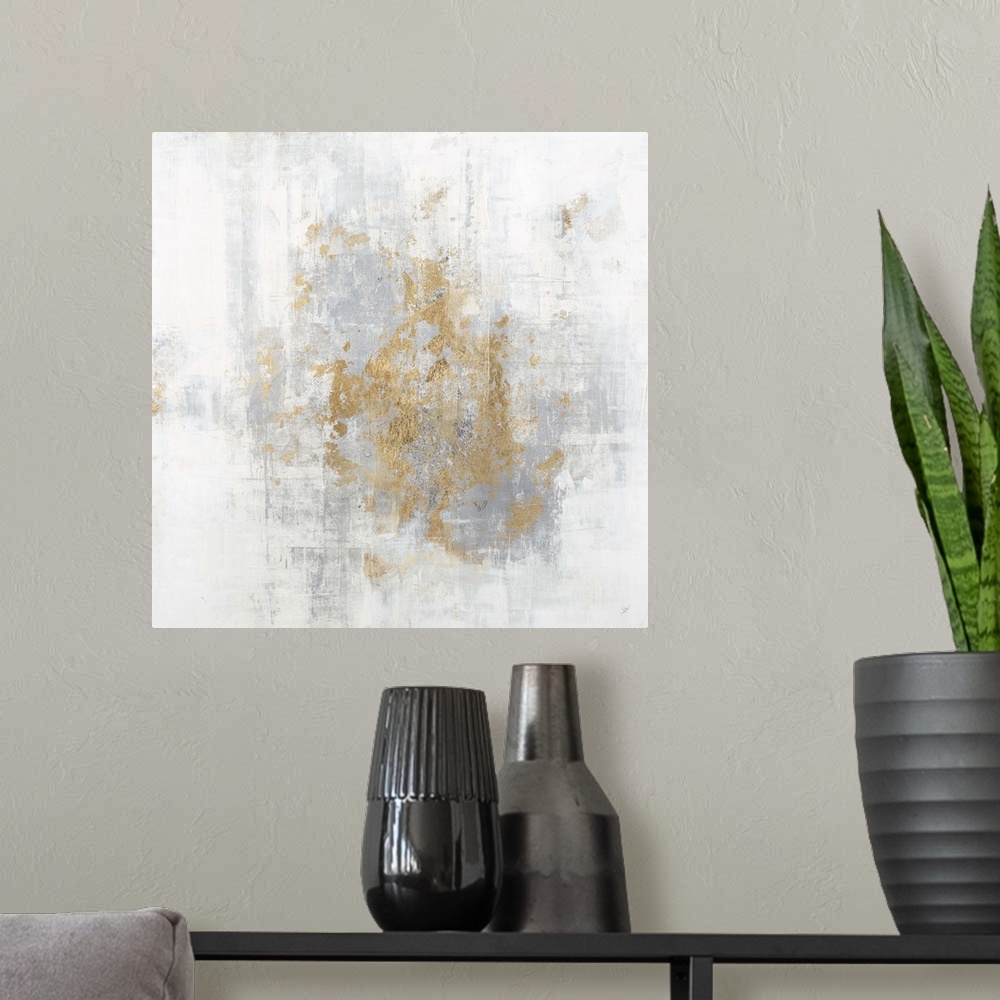A modern room featuring Square abstract art with a cool toned silver and white background and metallic gold on top.