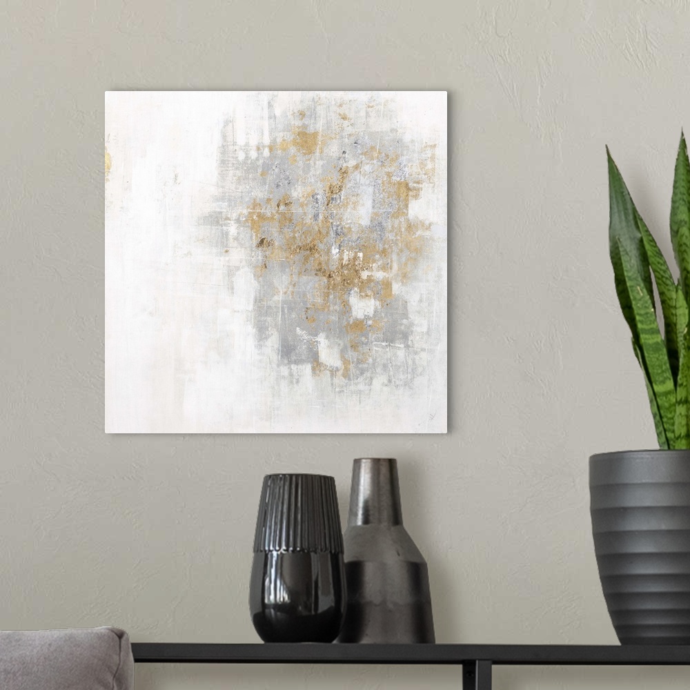 A modern room featuring Square abstract art with a cool toned silver and white background and metallic gold on top.