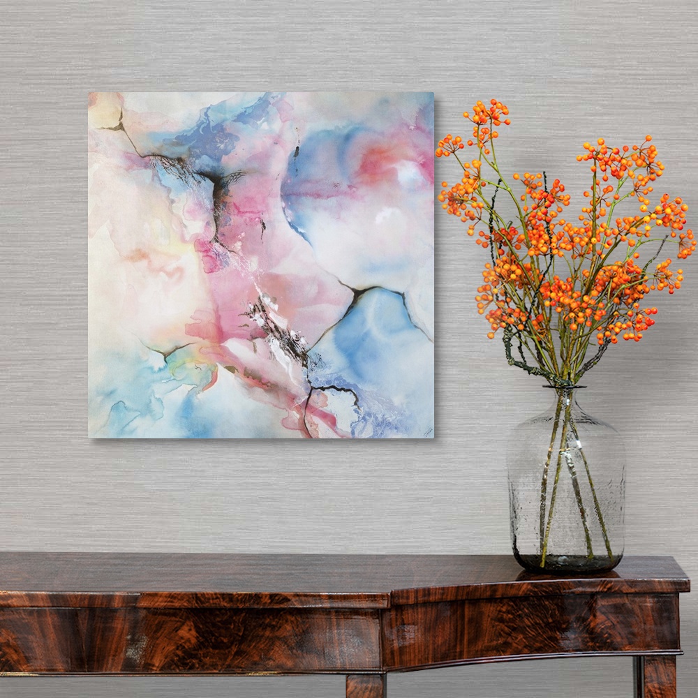 A traditional room featuring Square contemporary abstract painting with faded blue, pink, and yellow hues that appear like a w...