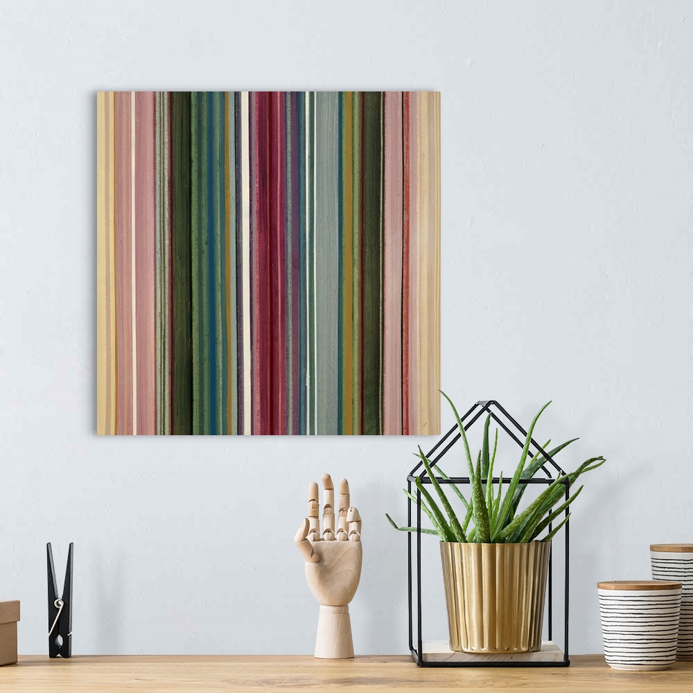 A bohemian room featuring Modern painting of many vertical stripes, side by side and in various colors and thicknesses.