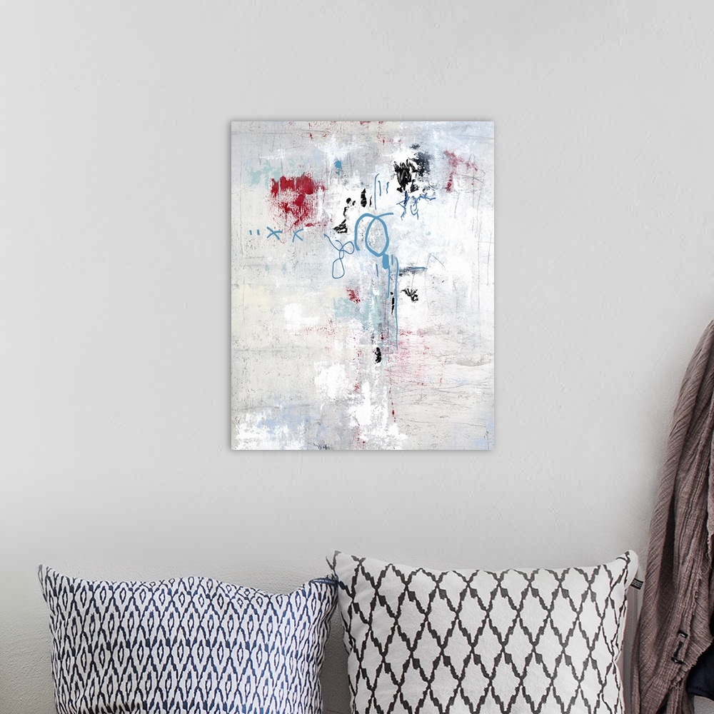 A bohemian room featuring Textured abstract painting with blue and red details.