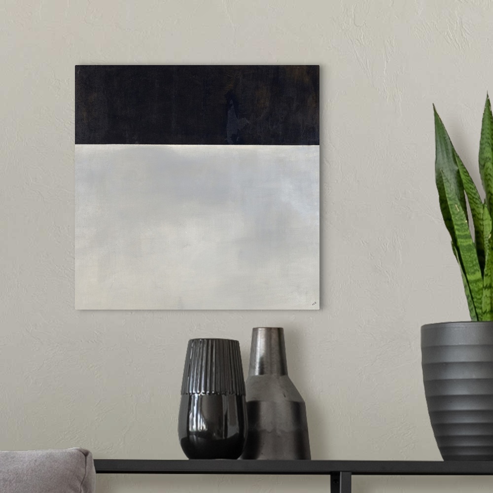 A modern room featuring Square abstract painting with a solid black rectangle at the top and fully gray bottom.