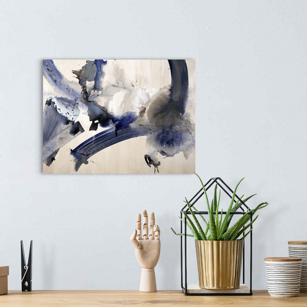 A bohemian room featuring Abstract watercolor painting with dark blue and black hues.