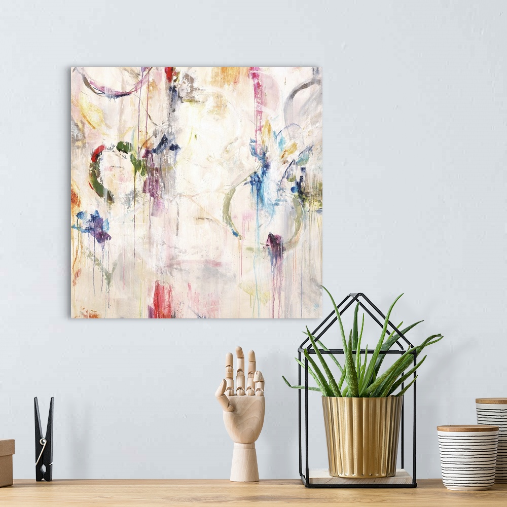 A bohemian room featuring Contemporary abstract painting in white with pops of bright colors in splatters and rings.
