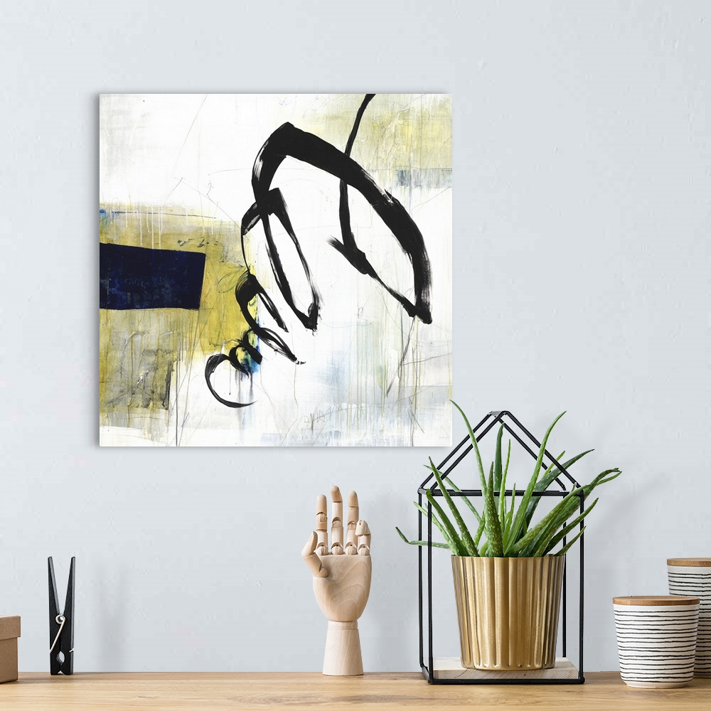 A bohemian room featuring Square abstract in white, gray, blue, and yellow hues with a bold black squiggly line on top.