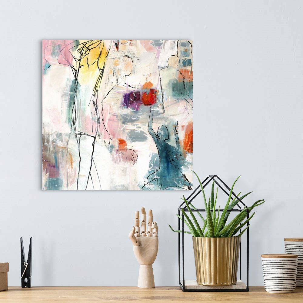 A bohemian room featuring Square abstract art with black outlined figures and pops of bright hues.