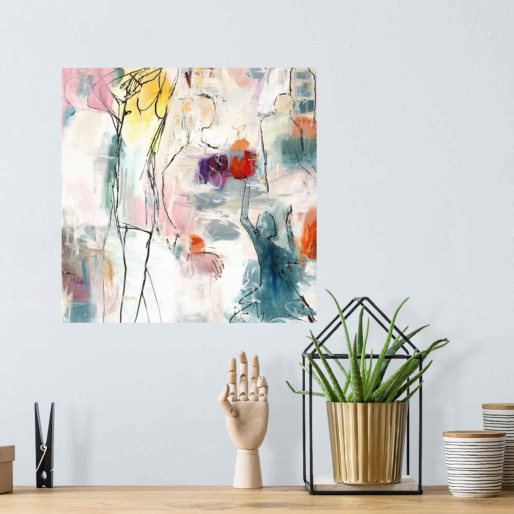 A bohemian room featuring Square abstract art with black outlined figures and pops of bright hues.