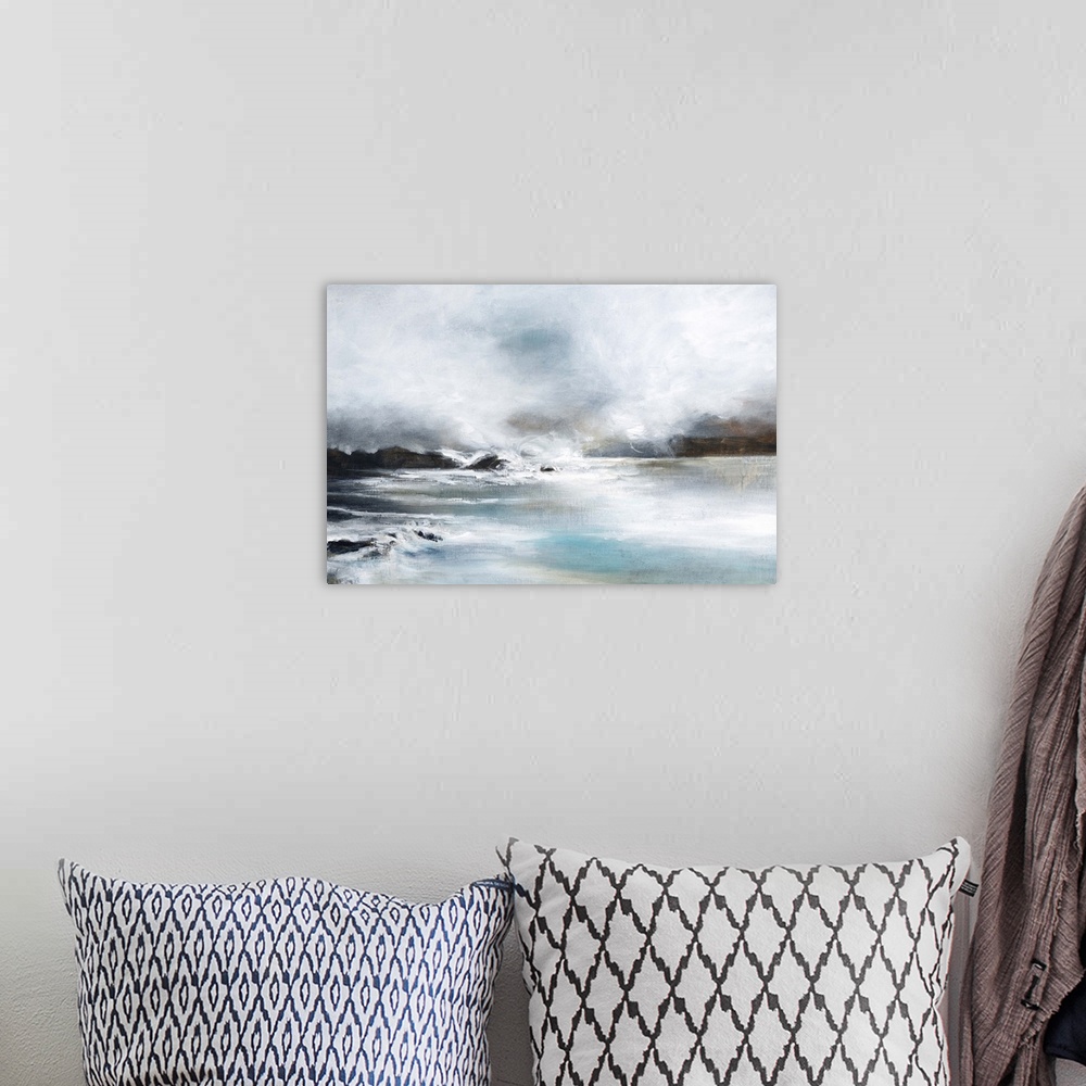 A bohemian room featuring Contemporary artwork of a seascape with mild waves on a cloudy day.