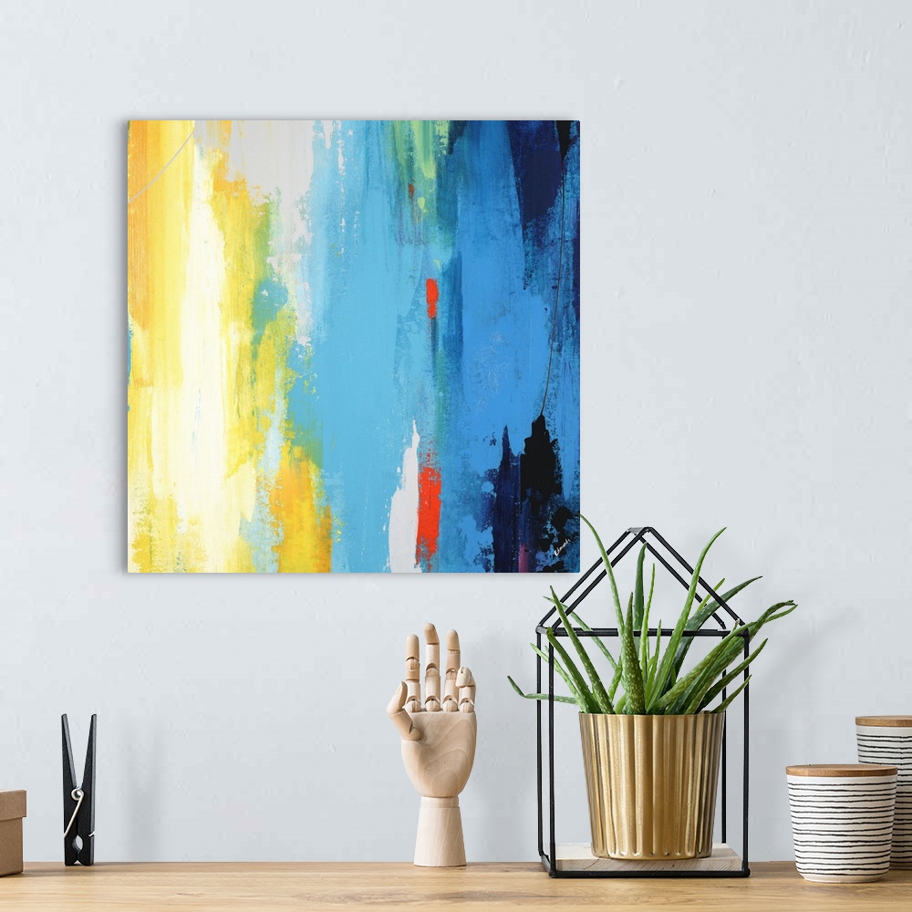 A bohemian room featuring A contemporary abstract painting using a full spectrum of colors in a vertical formation.