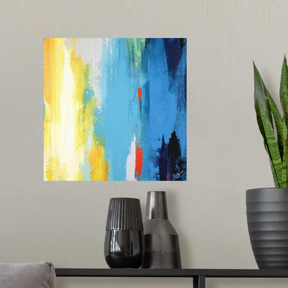 A modern room featuring A contemporary abstract painting using a full spectrum of colors in a vertical formation.