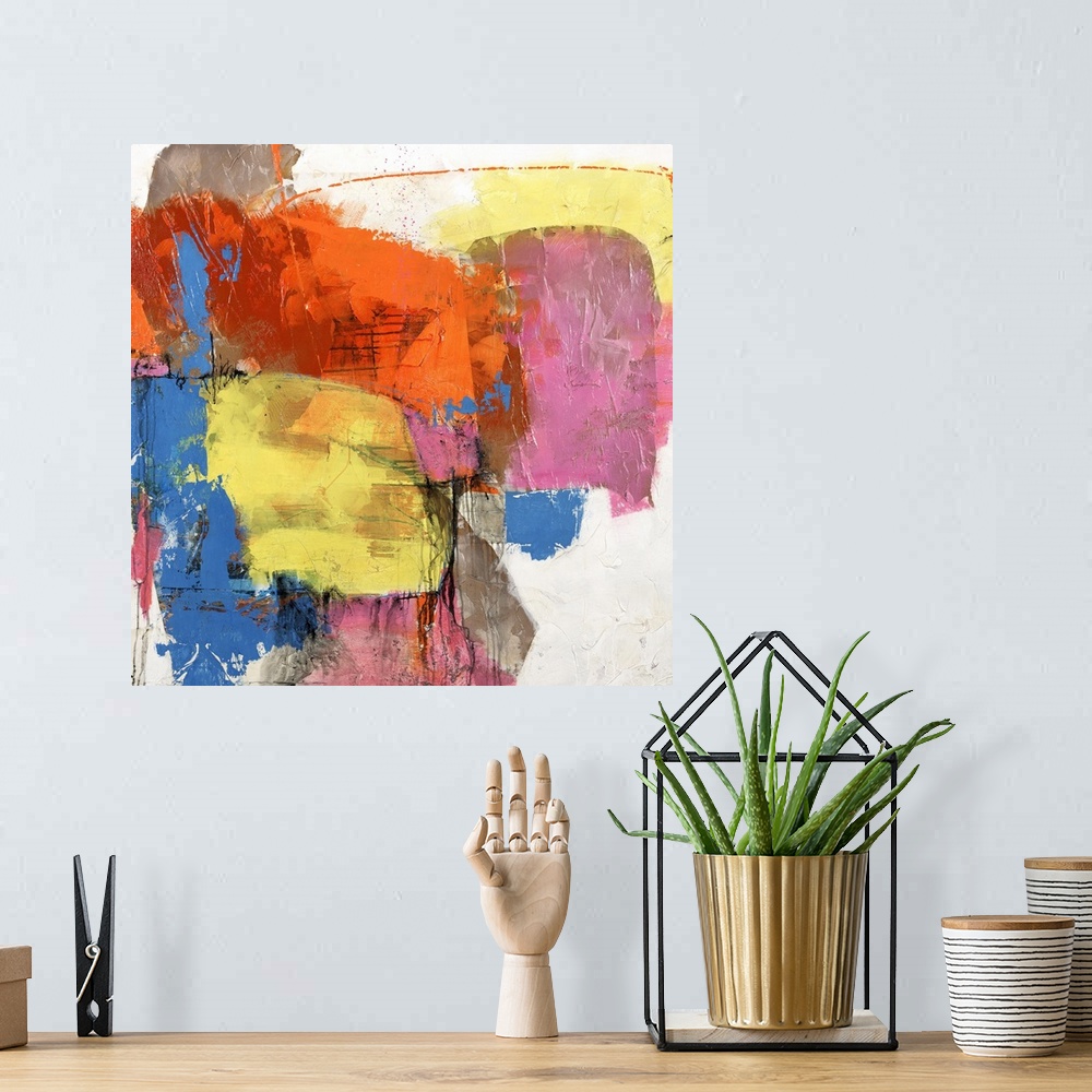 A bohemian room featuring Square abstract painting of vibrant colors in yellow, blue and orange.