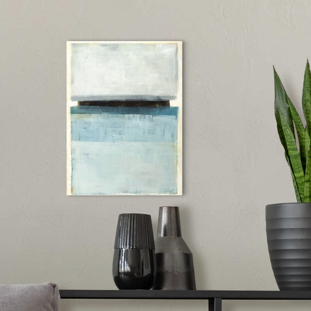 A modern room featuring Large abstract painting with rectangular sections of color in shades of blue and gray with one bl...