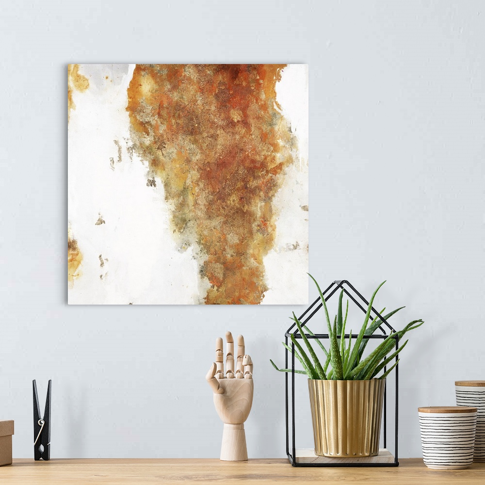 A bohemian room featuring Warm toned square painting with orange, yellow, copper, and gold on a white background with small...