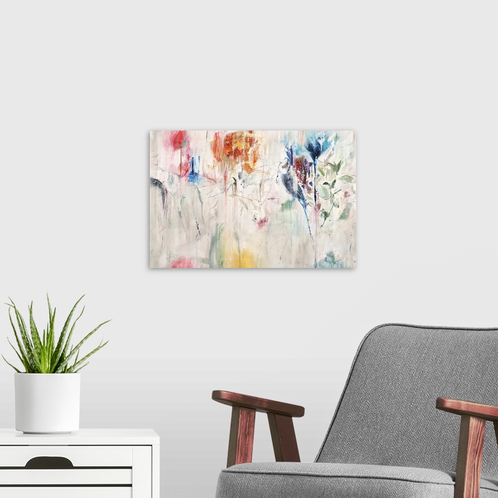 A modern room featuring Contemporary abstract painting of a colorful flowers against a neutral background.