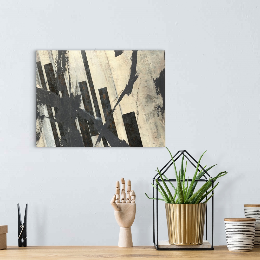 A bohemian room featuring Abstract artwork with splashes of black paint on an off white background with thick black bars al...