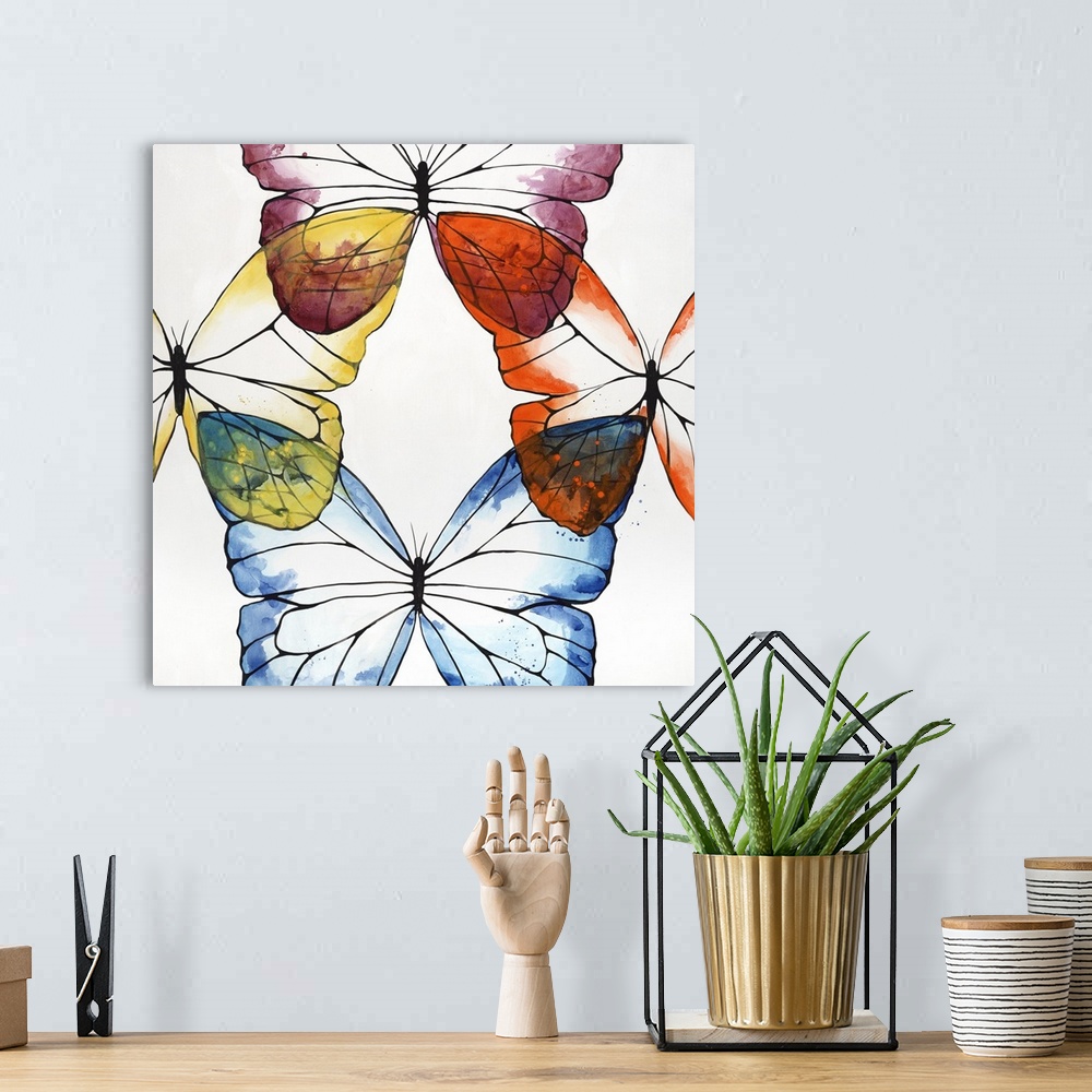 A bohemian room featuring Square painting of four butterflies connected by the wing on each side of the canvas with a white...