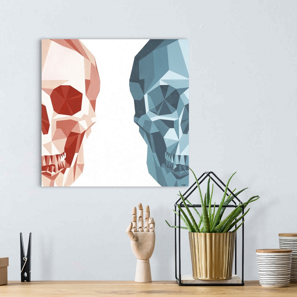 A bohemian room featuring Square artwork of two half skulls made with geometric shapes on the left and right sides of the c...