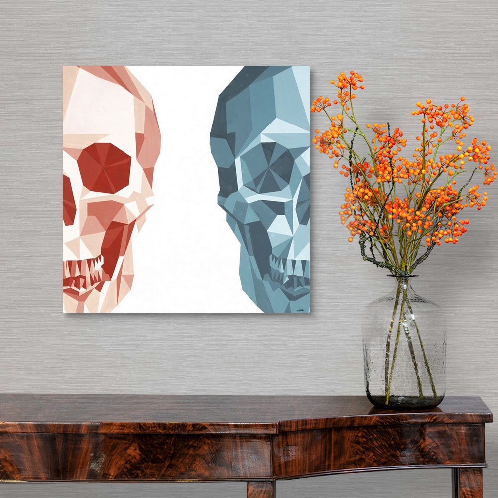A traditional room featuring Square artwork of two half skulls made with geometric shapes on the left and right sides of the c...