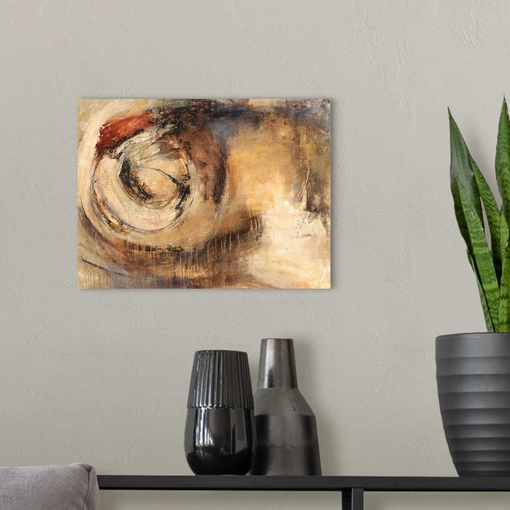 A modern room featuring Contemporary abstract painting of earth tones creating a circular shape.