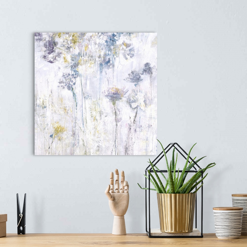 A bohemian room featuring Square abstract floral painting in shades of gray, yellow and blue.
