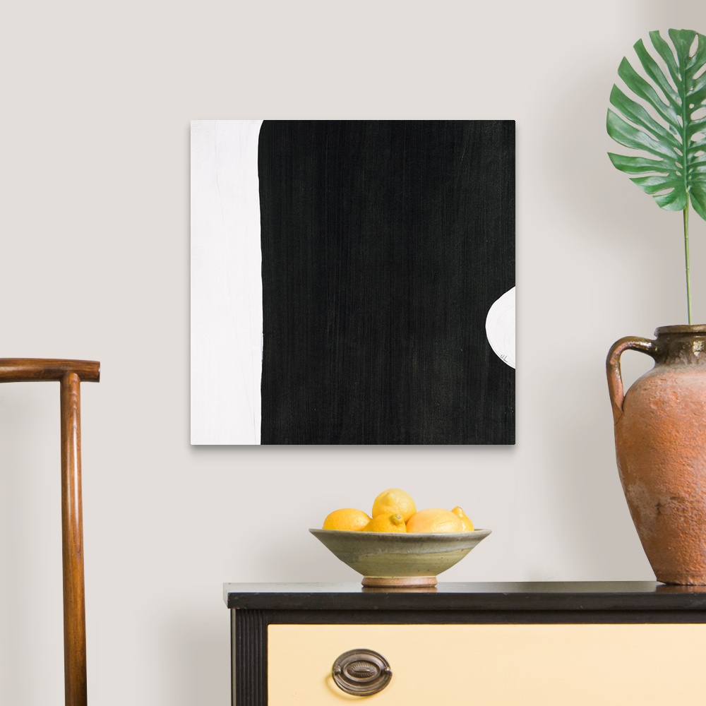 A traditional room featuring A black and white contemporary abstract painting with geometric shapes connecting together with l...