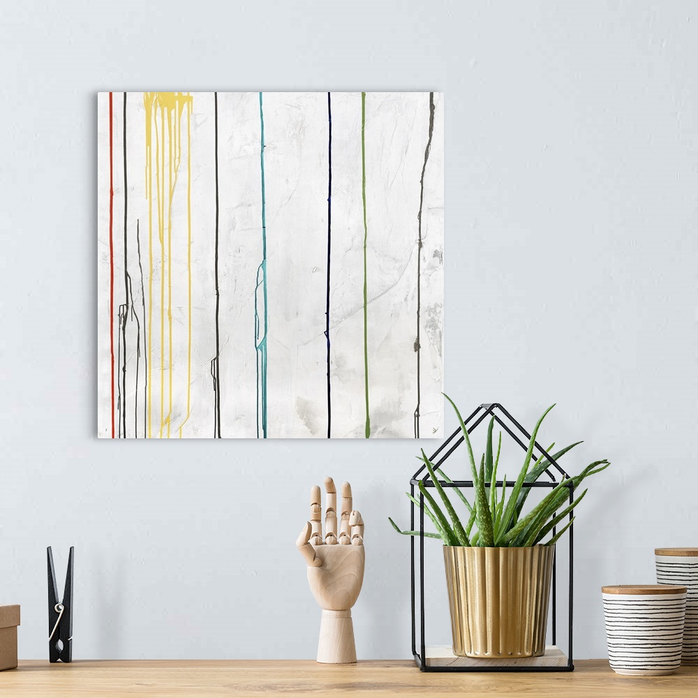 A bohemian room featuring Square abstract art with dripping lines of color in green, orange, yellow, dark blue, light blue,...