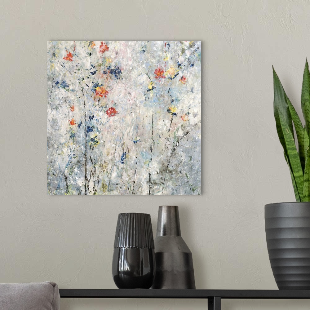 A modern room featuring Contemporary square painting with abstract flowers in blue, red, orange, and yellow hues on a gra...