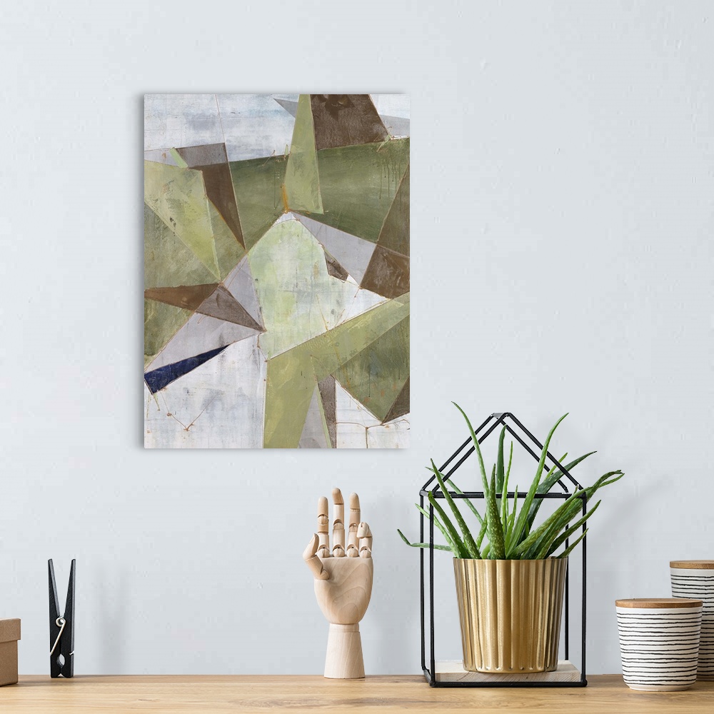 A bohemian room featuring Abstract painting of overlapping triangular shapes in neutral and earth tones, randomly placed an...