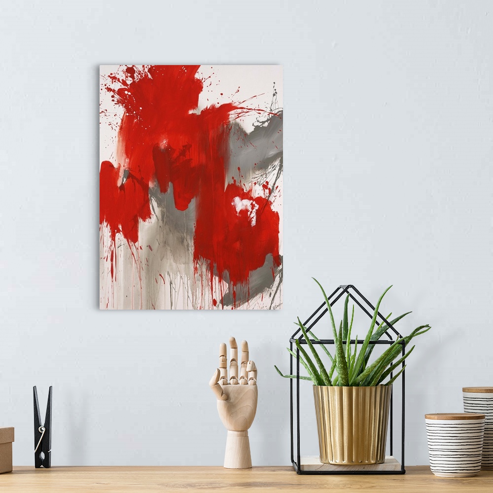 A bohemian room featuring Contemporary abstract painting of a giant red splash of paint smeared and splattered against a ne...