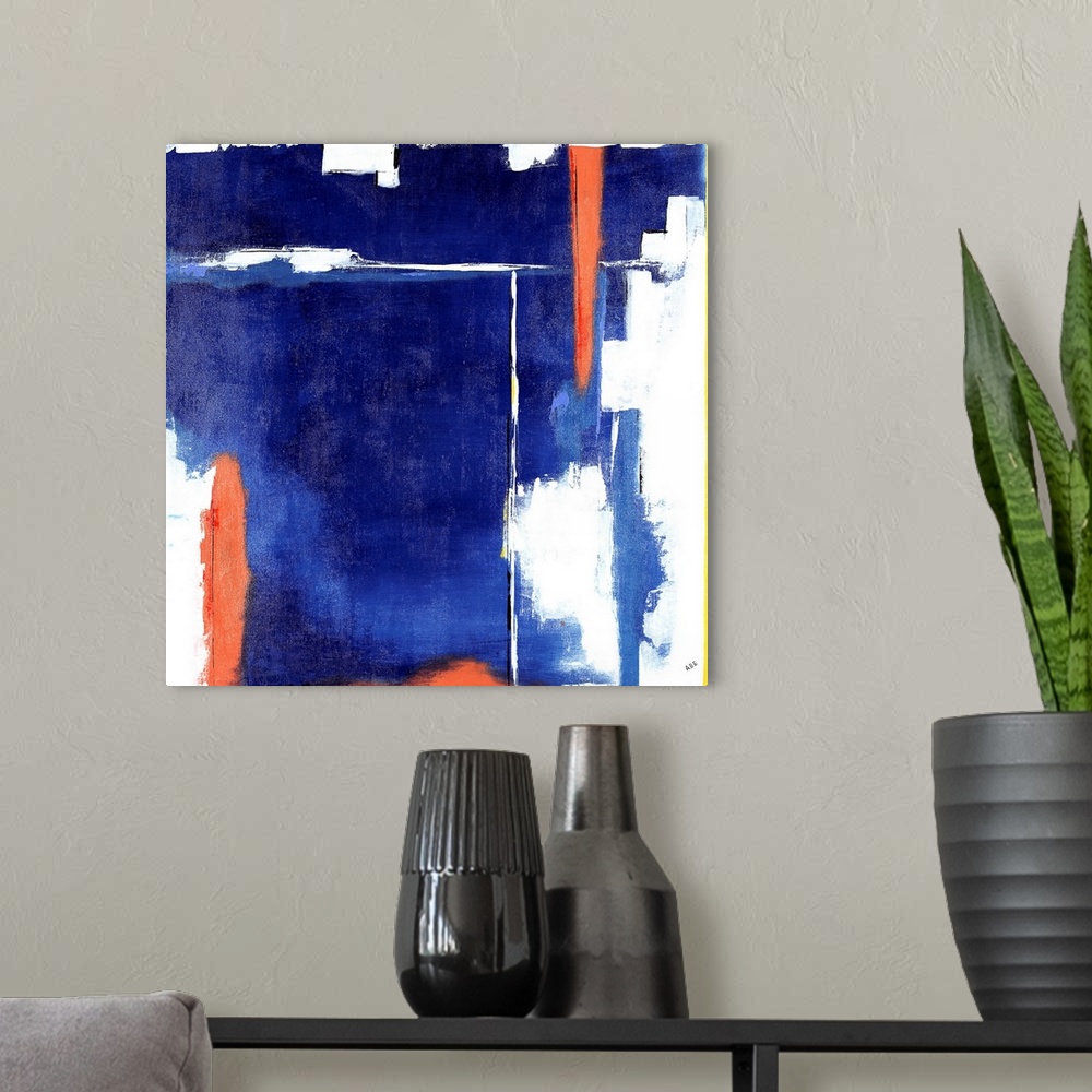 A modern room featuring Square abstract art with heavy blue hues on the background and bright orange, white, and yellow l...