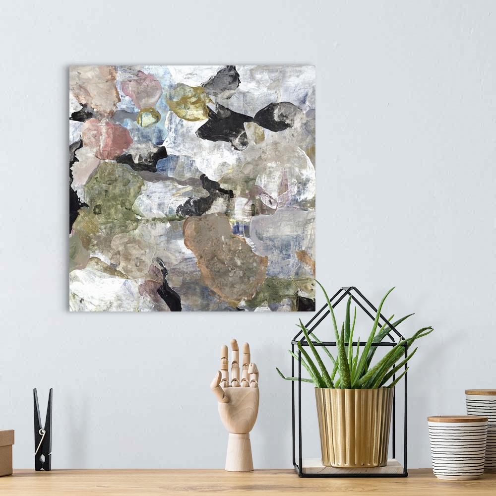 A bohemian room featuring A square abstract painting of rounded multi-colored shapes with a marbled effect.