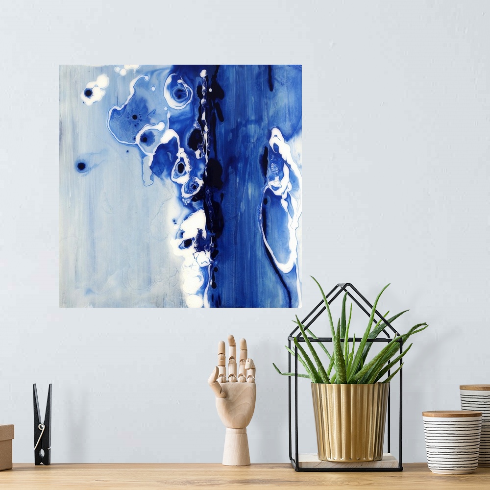 A bohemian room featuring Contemporary abstract painting of what looks like flowing dark blue liquid.