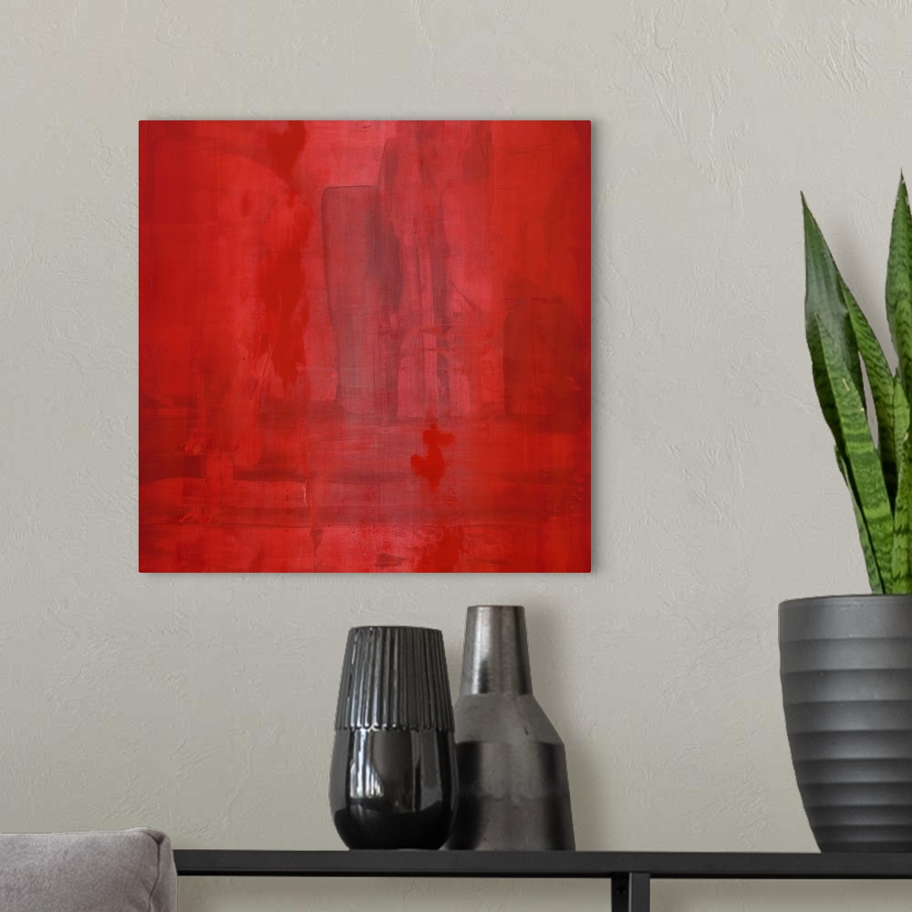 A modern room featuring Contemporary abstract painting of a dominating deep red covering the canvas, with a dark geometri...